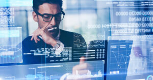 A business leader studies marketing performance data, highlighting the challenge SMBs face in knowing which strategies work.