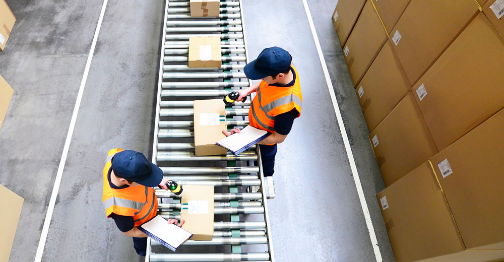 E-commerce returns being inspected and sorted in a fulfillment center