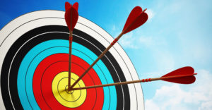 Arrows hitting a bullseye target symbolizing sales teams improving execution and performance consistency through AI-driven training.