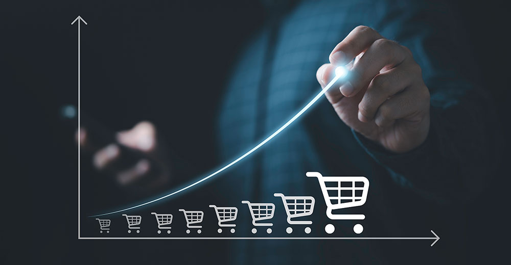 A rising graph made of shopping carts illustrating how extended online sales events build momentum and drive higher retail performance over time.