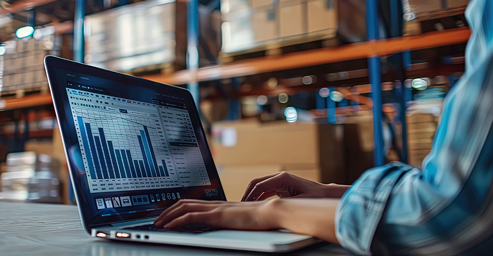 Warehouse e-commerce data on laptop screen showing order growth
